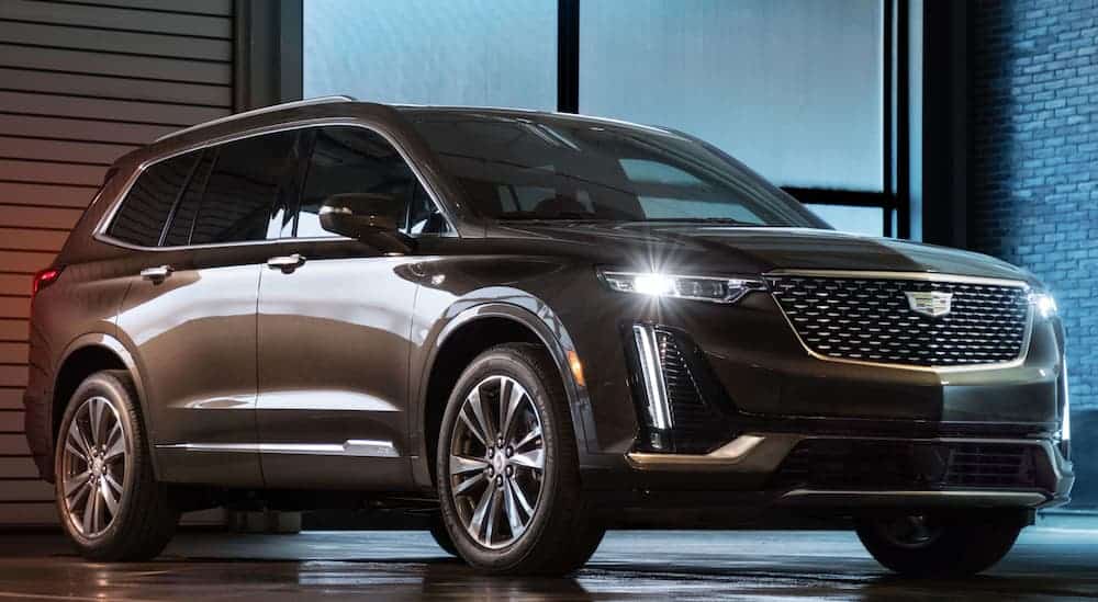 A brown 2020 Cadillac XT6, which is popular option for Cadillac lease deals, is parked in a showroom. 