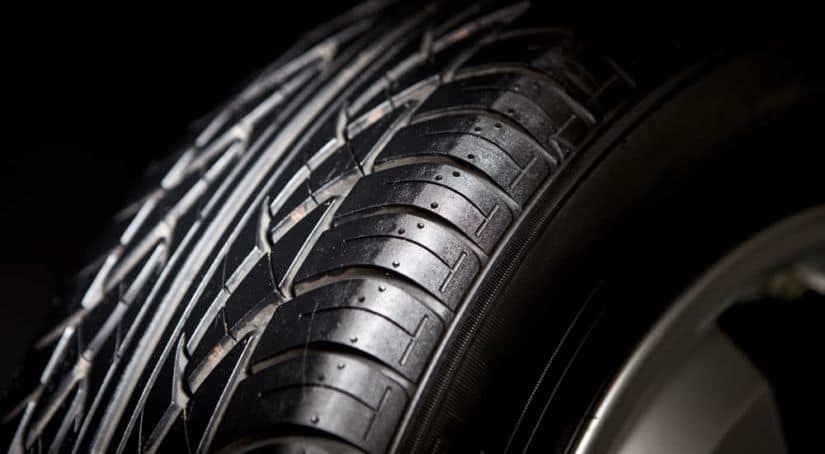 A close up of a car tire is shown.