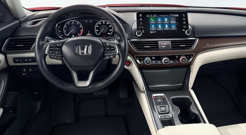 The black and cream interior of a 2020 Honda Accord is shown.