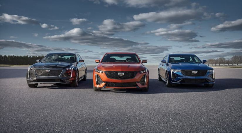 Three 2020 Cadillac models are parked next to each other while facing forward.