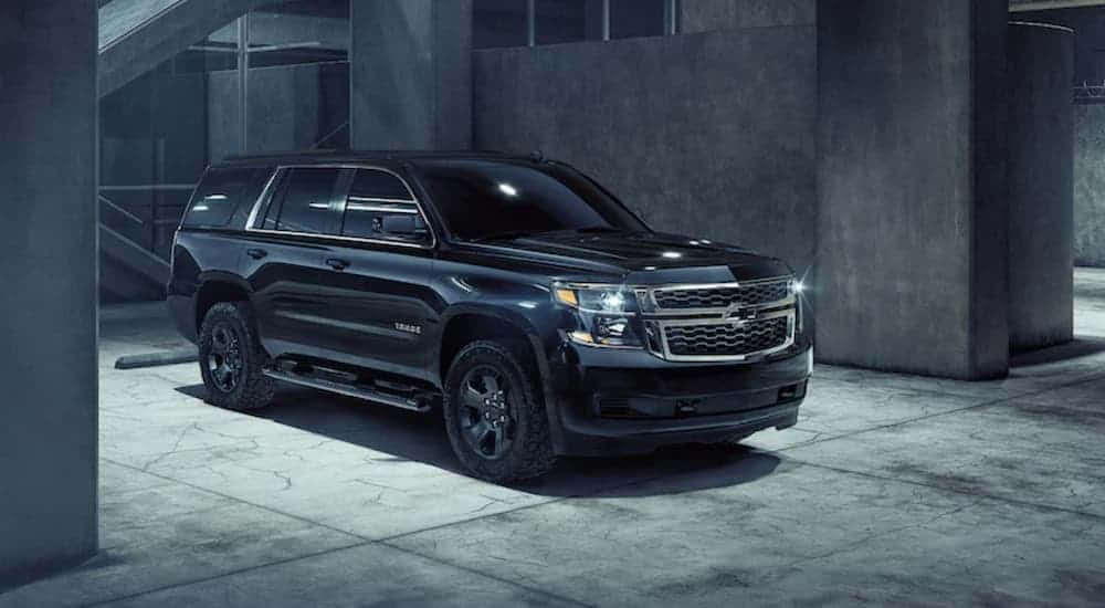 An all black 2020 Chevy Tahoe is in a parking garage.