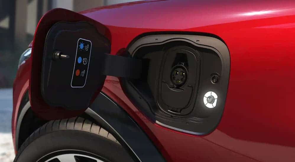 A close up of an EV vehicle's charging port is shown.