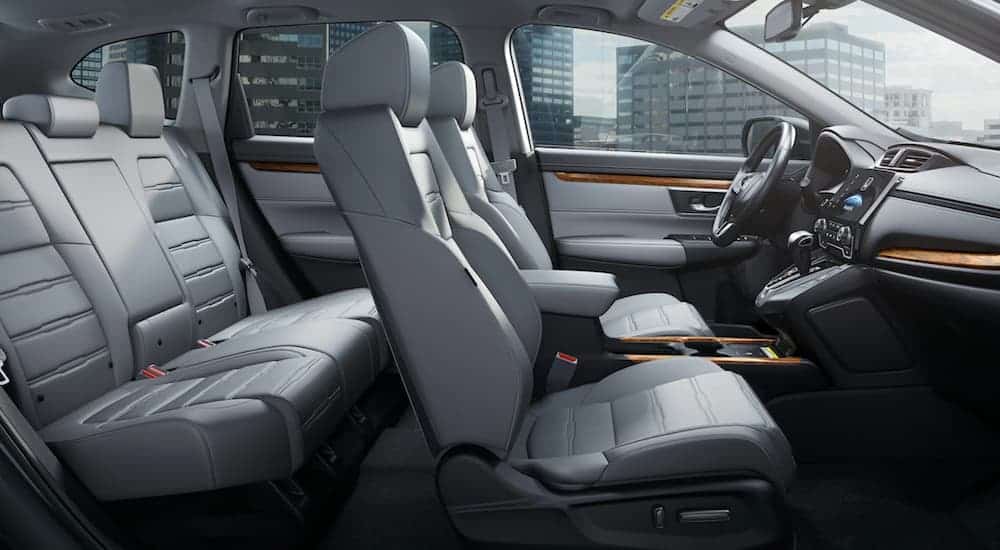 The grey interior of a 2020 Honda CR-V is shown from the side.