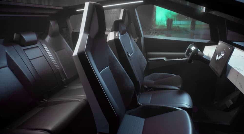 A side view of the, what could be, black leather interior of the Tesla Cybertruck is shown.