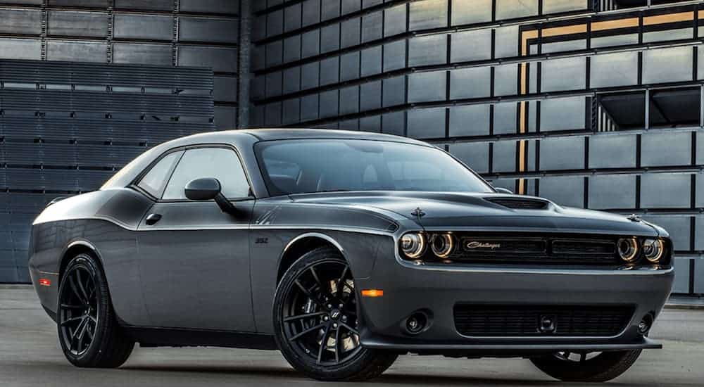 A grey 2018 Dodge Challenger, popular among used cars, is in an industrial building.