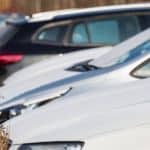 A row of used cars is shown.