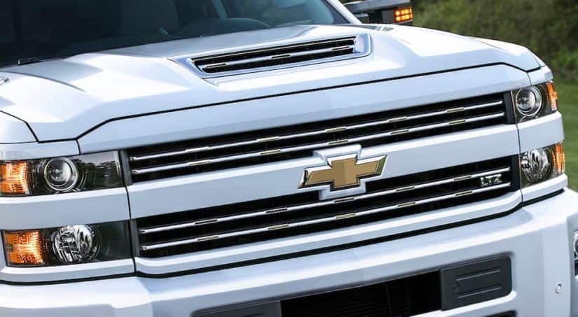 A close up of a white 2017 Chevy Silverado 1500 is shown.