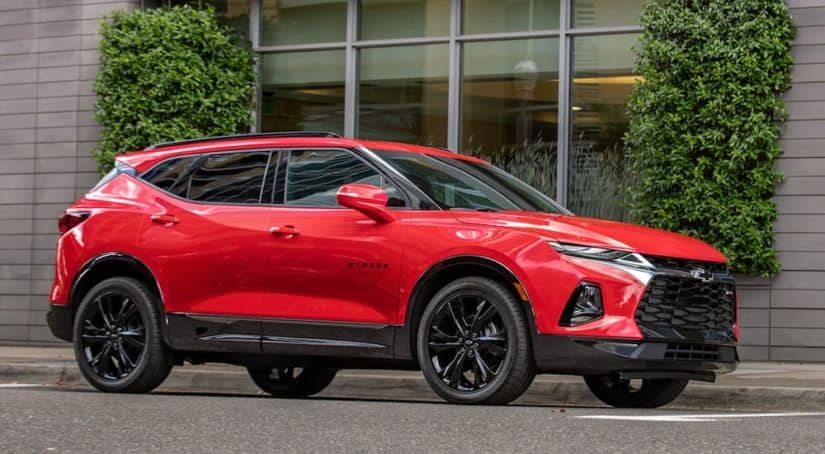 A red 2020 Chevy Blazer RS is parked on a city street.
