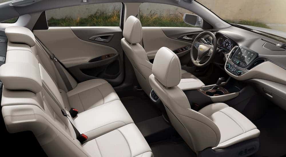 A side view of the cream interior in a 2020 Chevy Malibu is shown.