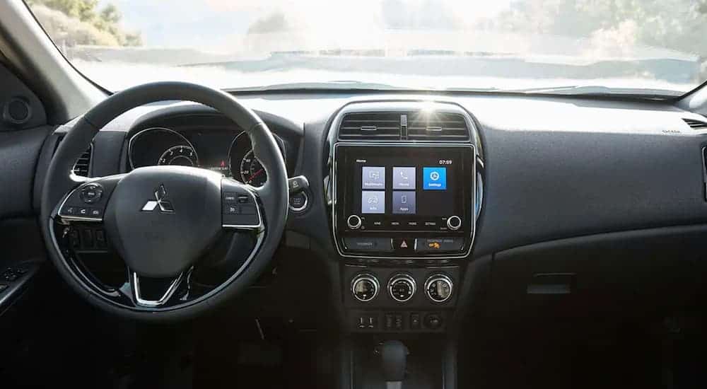 The dashboard of a 2020 Mitsubishi Outlander Sport is shown.