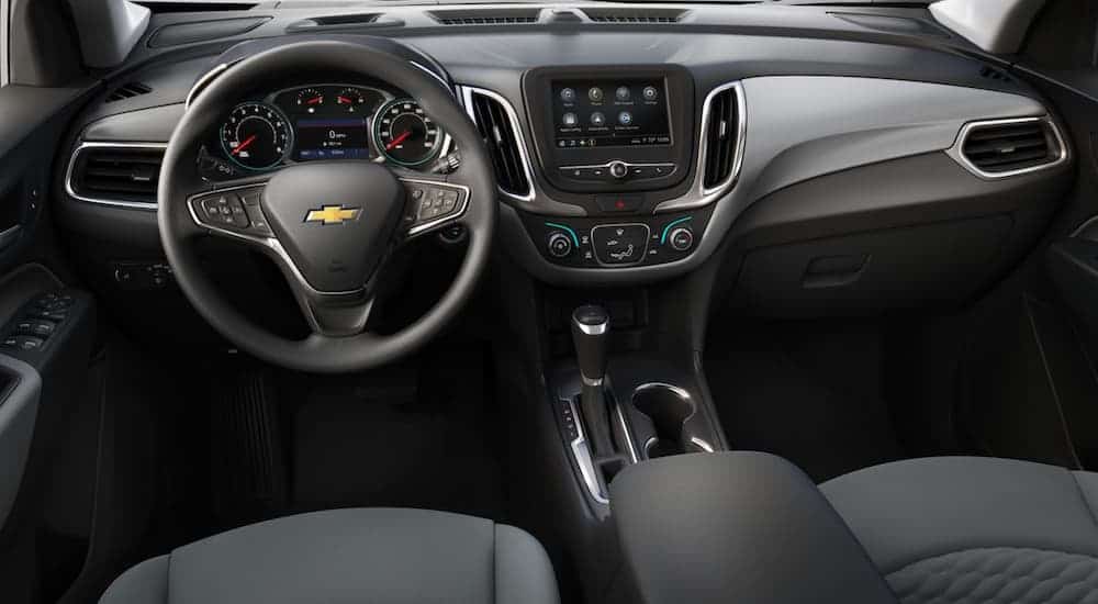 The black interior of a 2020 Chevy Equinox LT is shown.