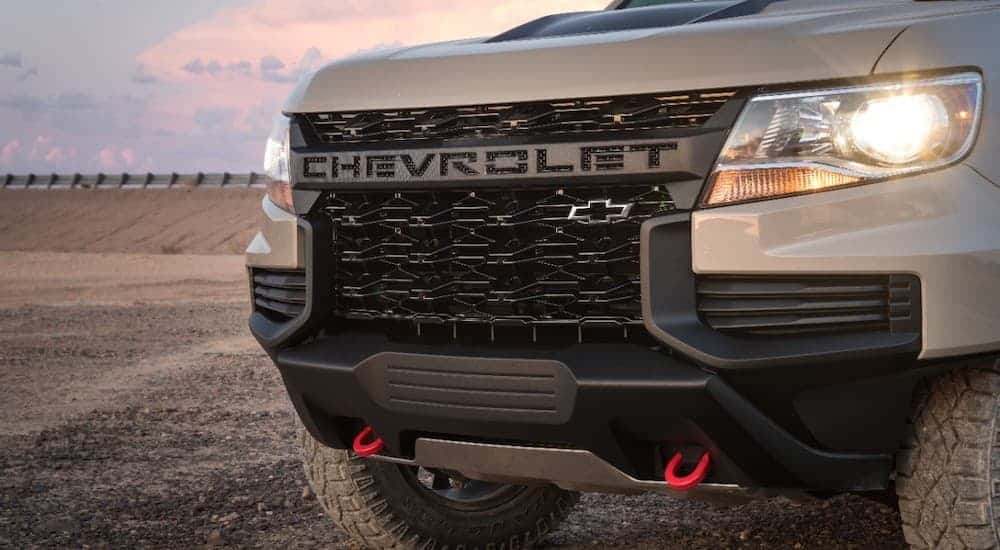 The grille of a tan 2021 Chevy Colorado ZR2 is shown.