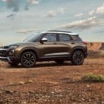 A brown and white 2021 Chevy Trailblazer Activ is parked victoriously in a desert after winning 2021 Chevy TrailBlazer vs 2020 Mazda CX-30.