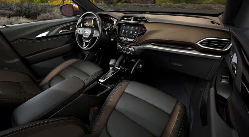 The two-tone tan and black leather interior of a 2021 Chevy Trailblazer Activ is shown.