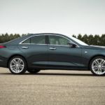 A gray 2020 Cadillac CT4 is parked in an empty lot after leaving a Cadillac dealer near me.