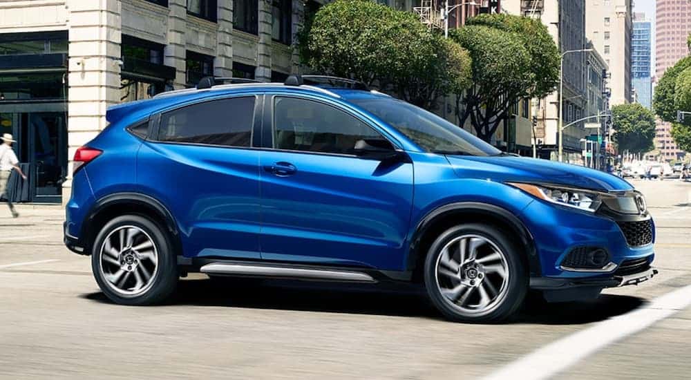 A blue 2020 Honda HR-V is in a city intersection.