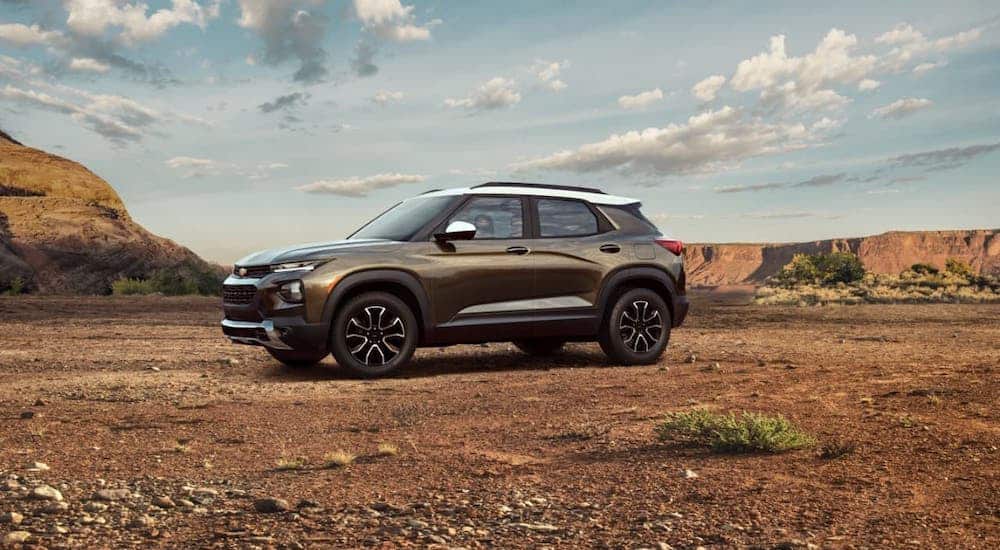 A brown and white 2021 Chevy Trailblazer is parked in a desert.