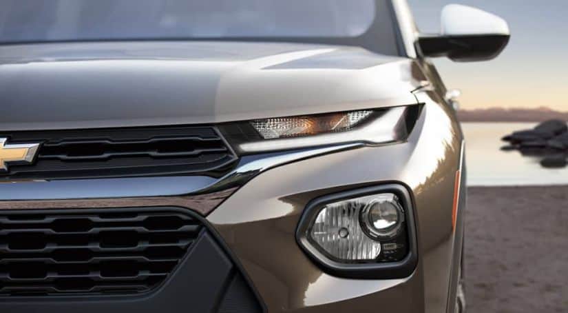 A closeup is shown of the grille on a brown 2021 Chevy Trailblazer Activ.