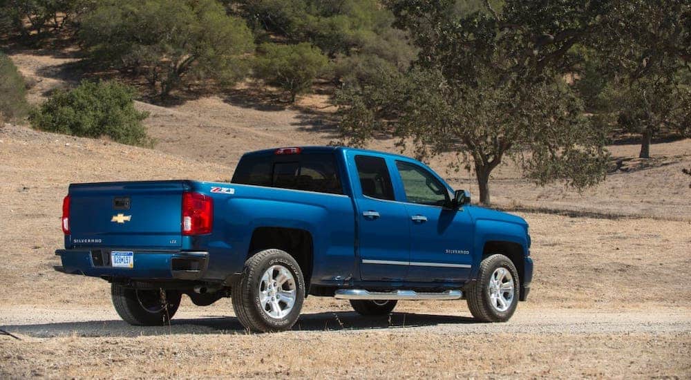 A popular used truck, a blue 2016 Chevy Silverado, is parked in a field outside Albany, NY.