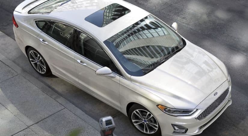 A white 2020 Ford Fusion is shown from above after winning the 2020 Ford Fusion vs 2020 Chevy Malibu comparison.