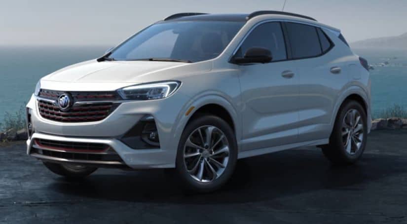 A white 2020 Buick Encore GX is parked in front of the ocean.