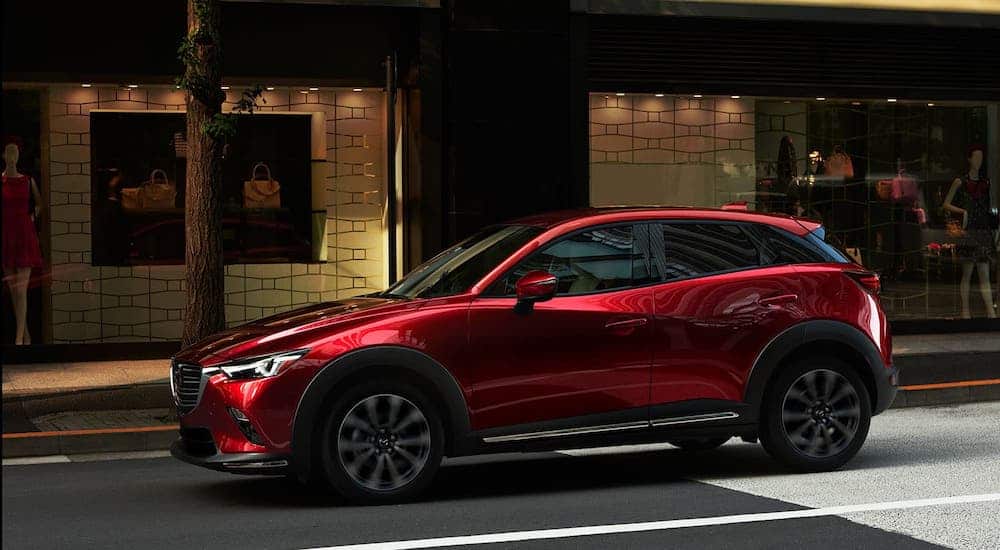 A red 2020 Mazda CX-3 is parked on a street after losing the 2020 Chevy Trax vs 2020 Mazda CX-3 comparison.