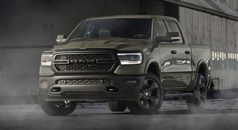 A green 2020 Ram 1500 is parked in a warehouse after winning the 2020 Ram 1500 vs 2020 Chevy Silverado 1500 comparison.