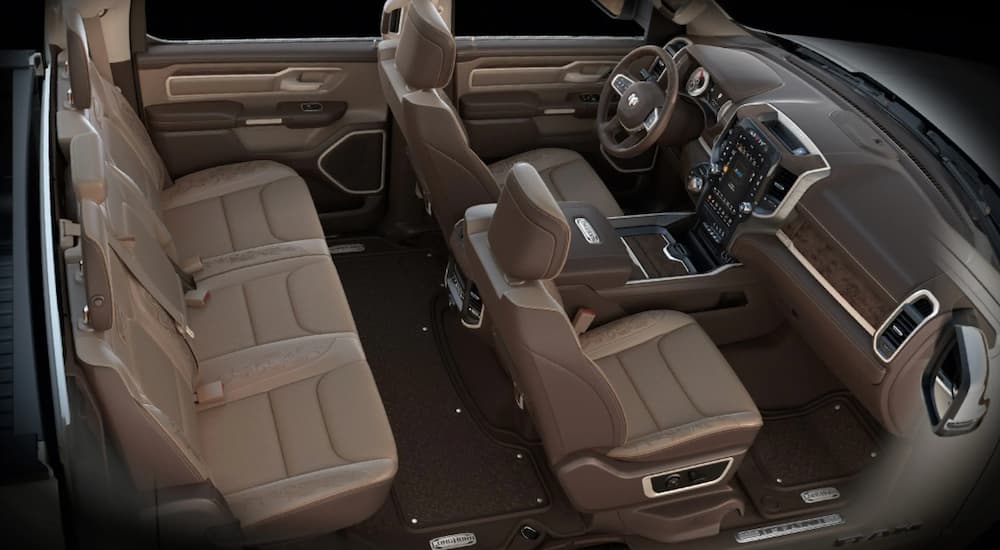 The brown interior of a 2020 Ram 1500 is shown from an above side angle. 