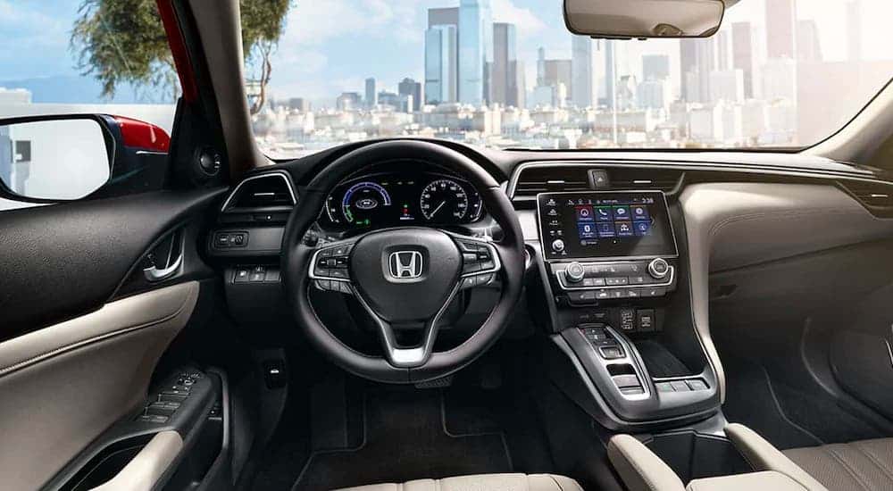 The dashboard and steering wheel are shown in a 2021 Honda Insight.