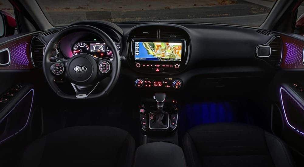 The black interior with purple lighting is shown on a 2021 Kia Soul.
