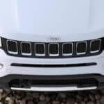 A white 2020 Jeep Compass hood is shown from above.