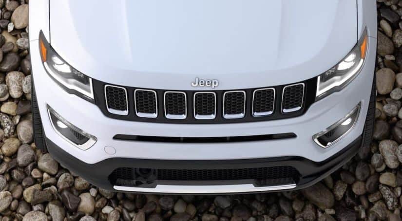 A white 2020 Jeep Compass hood is shown from above.