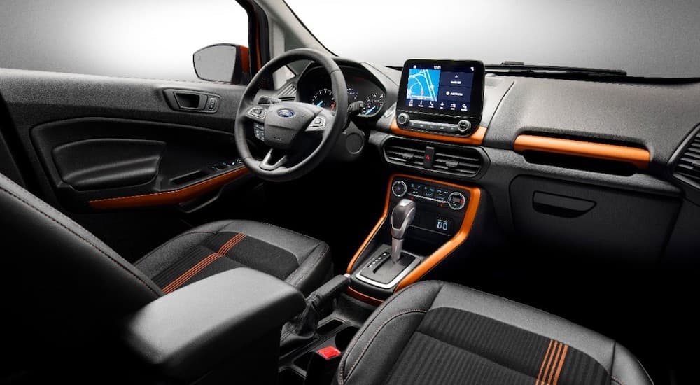 The black and orange interior is shown on a 2016 used Ford EcoSport.