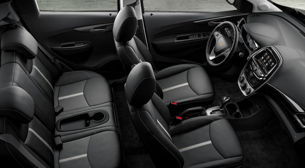 The black rows of seats in a 2021 Chevy Spark are shown from above.