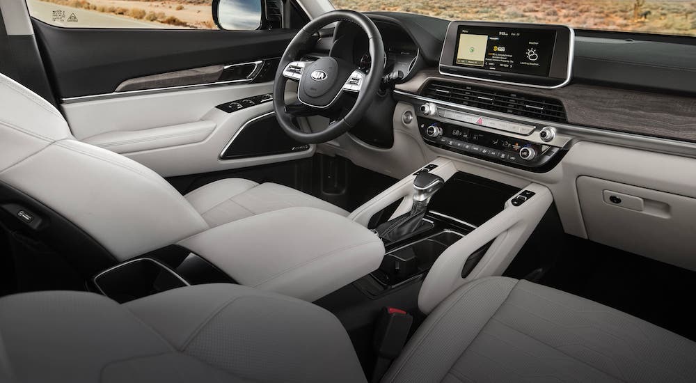 The white leather front seats and dashboard are shown in a 2021 Kia Telluride.