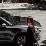 A couple is about to get into a gray 2020 Mazda CX-5, shown from the side.