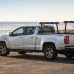 A silver 2018 Chevy Colorado, which is a popular used Chevy truck for sale, is parked at the ocean.