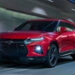 A red 2020 Chevy Blazer is driving down a tunnel.
