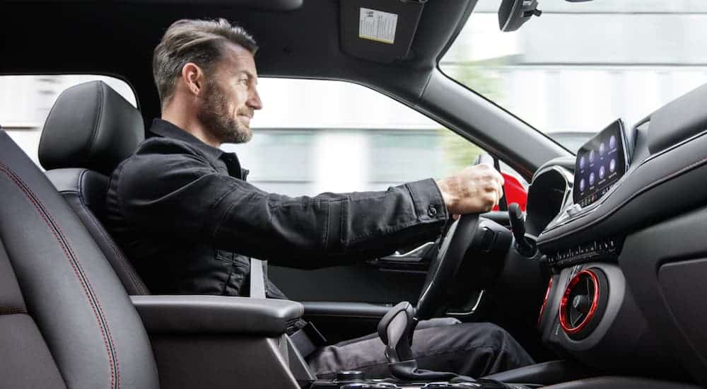 A man is shown driving the 2020 Chevy Blazer.