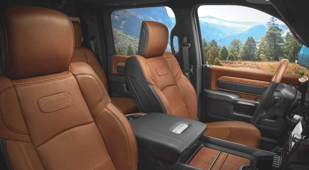 The tan and black interior is shown on a 2020 Ram 3500 Laramie Longhorn.