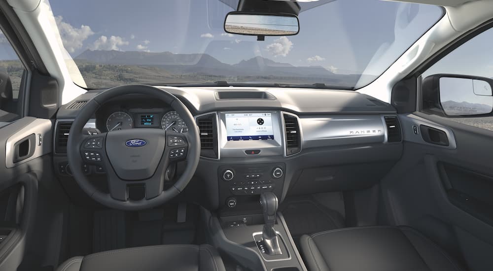 The black interior of a 2021 Ford Ranger STX SE is overlooking the mountains.