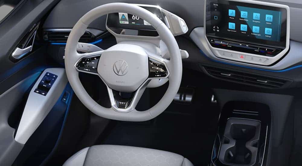 The back and white interior of a 2021 Volkswagen ID.4 is shown.