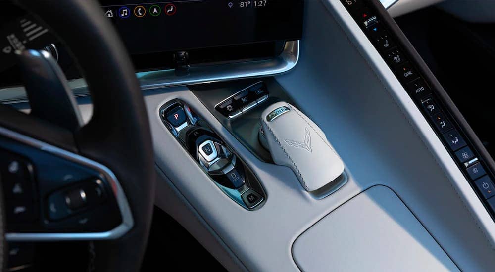 A close up is shown of the gear selector and grey center console on a 2021 Chevy Corvette.
