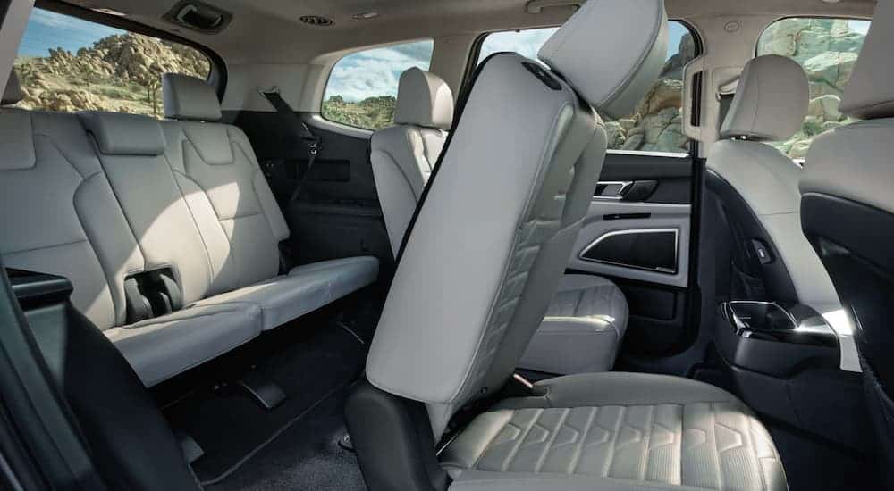 The grey interior and third row seating is shown from the side on a 2021 Kia Telluride.