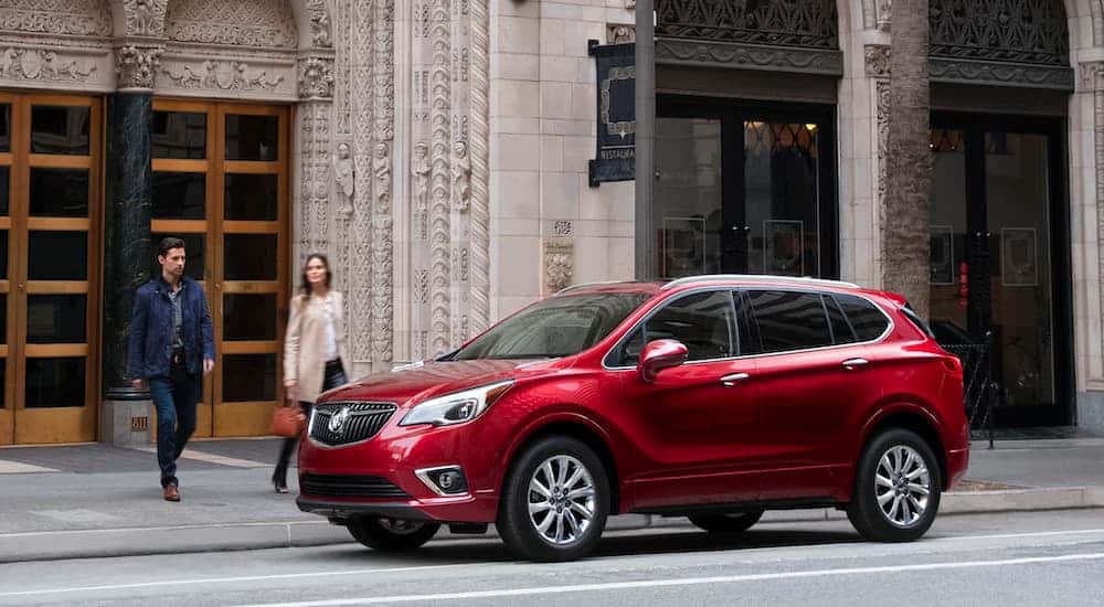 A red 2020 Buick Envision is parked in the city after leaving the Buick dealer.