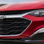 The front of a red 2020 Chevy Malibu is shown.