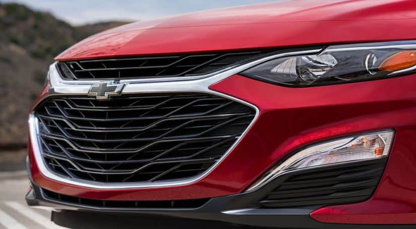 The front of a red 2020 Chevy Malibu is shown.