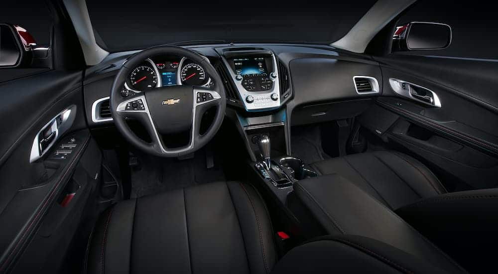 The black interior is shown on a 2016 used Chevy Equinox LTZ.
