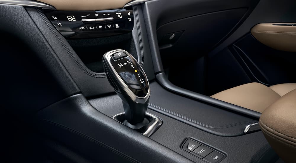 The black interior, shifter, and climate controls are shown on a 2017 Cadillac XT5.