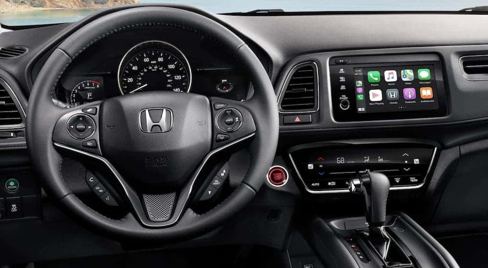 The black leather interior and infotainment system is shown on a 2021 Honda HR-V.